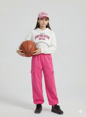 Girl wearing white cropped hoodie and pink cargo joggers holding a basketball – Sporting Nation India